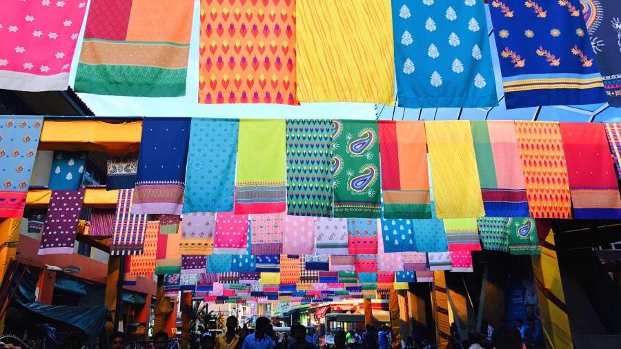 Colorful linens in market in Asia